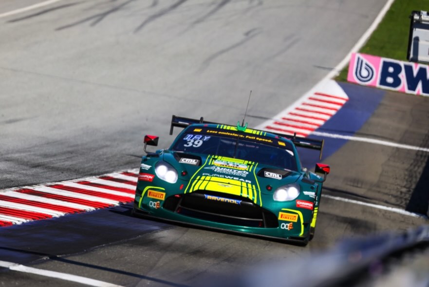 Race car on a track with visible branding